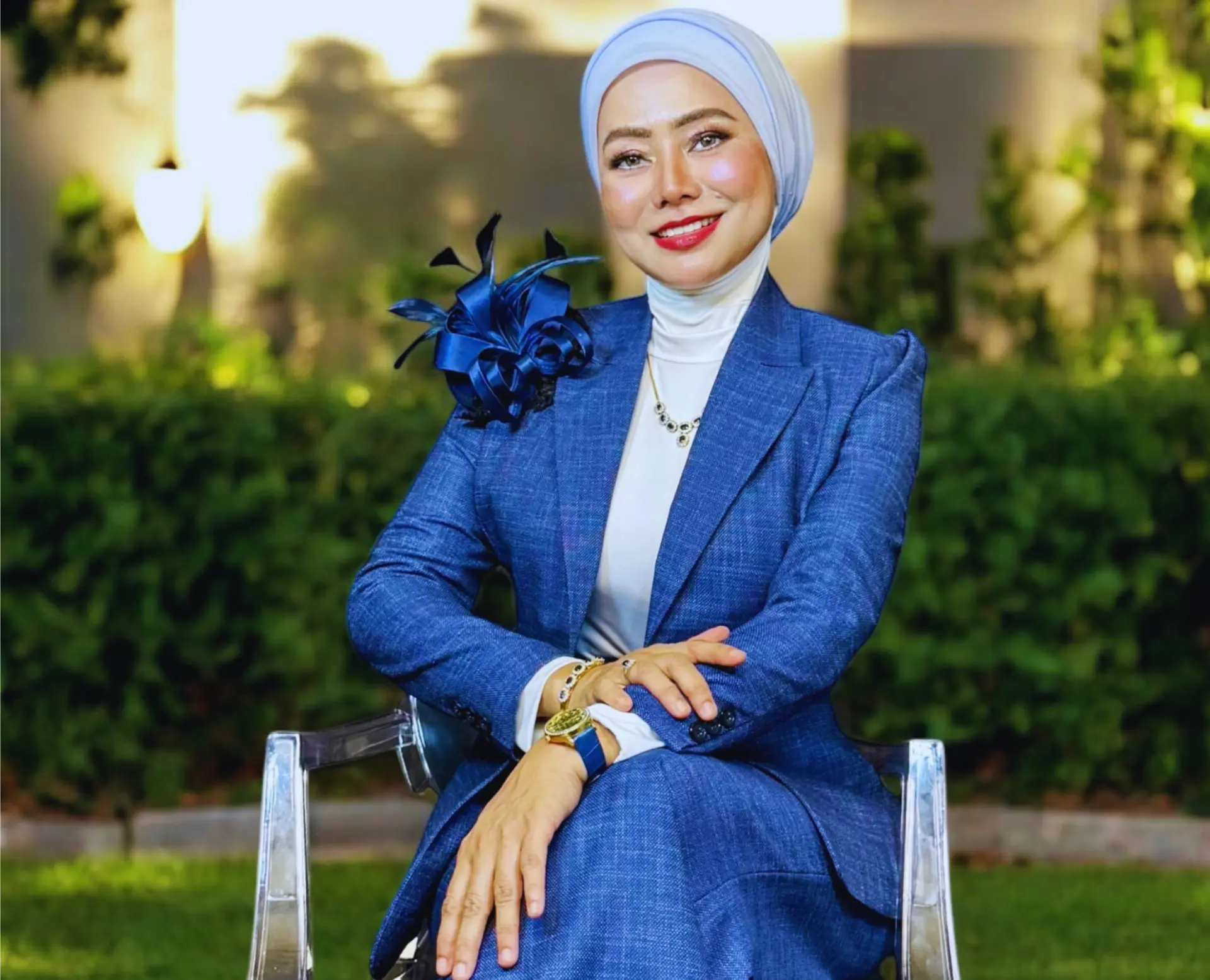 Madam Era in blue jacket